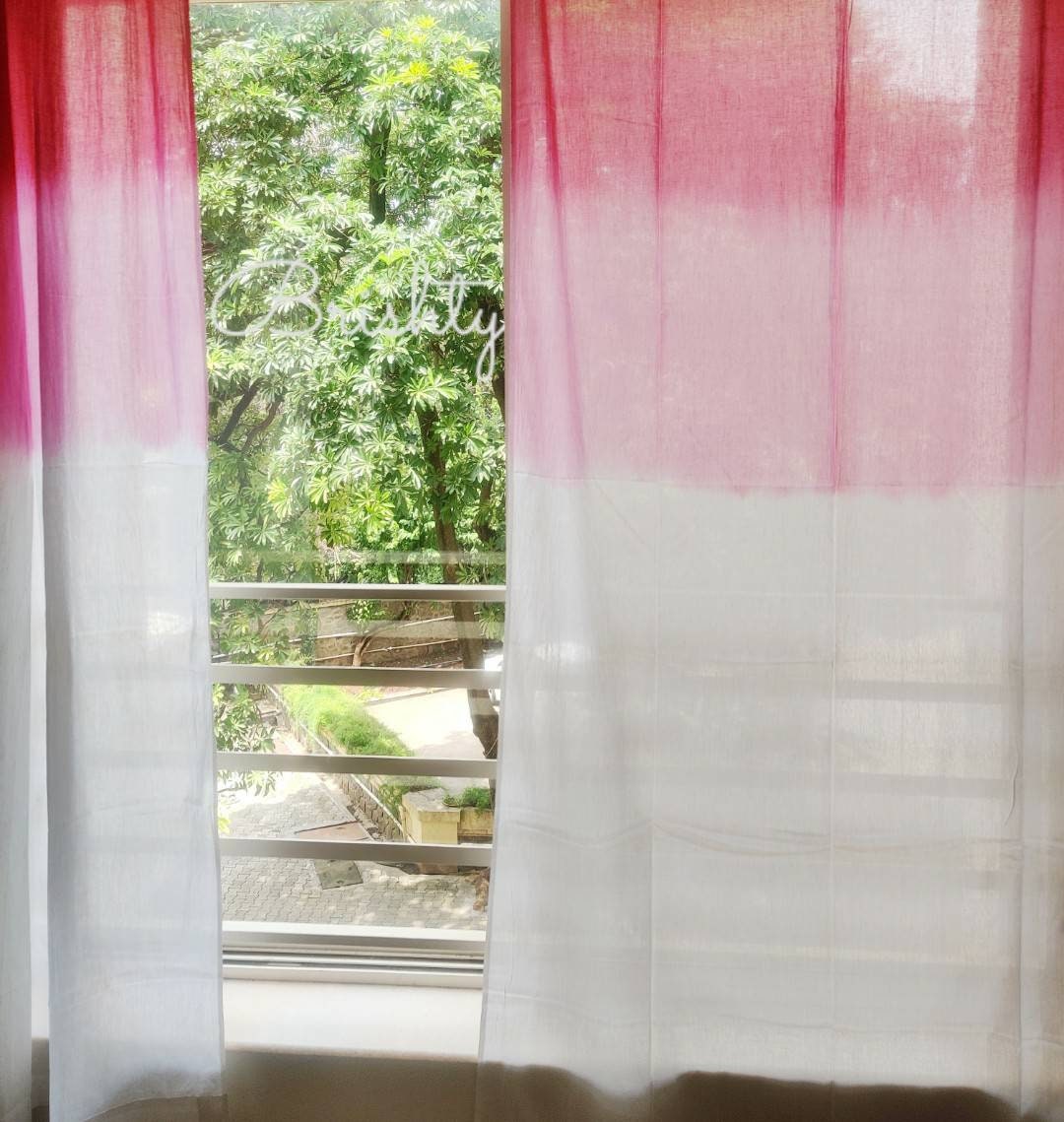 Pink and white ombre sheer curtain panels,