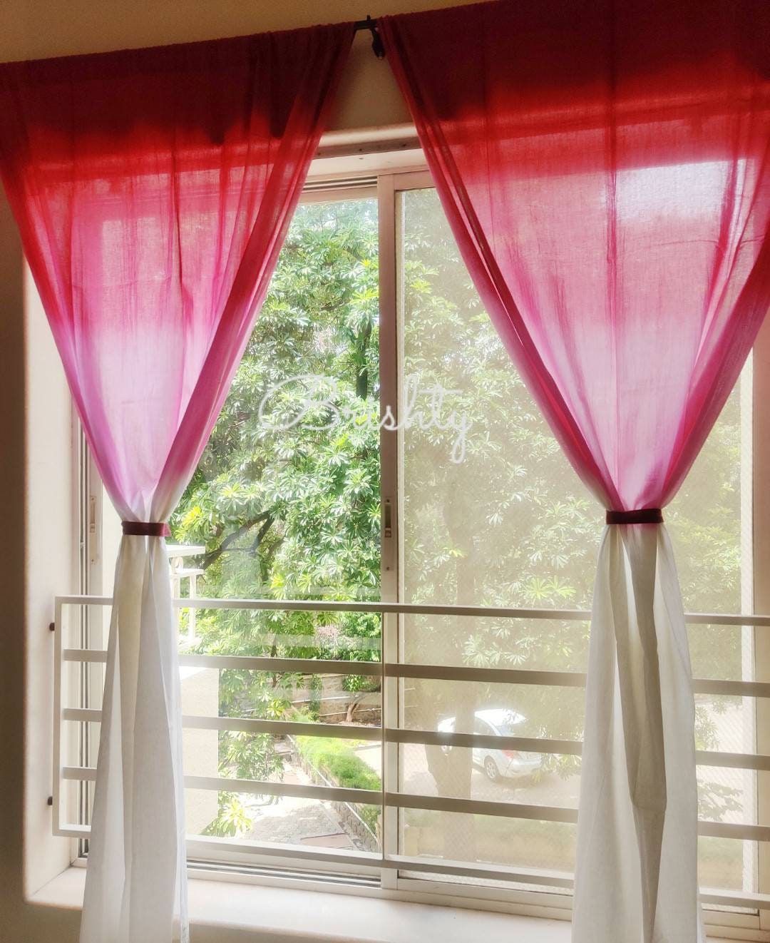 Pink and white ombre sheer curtain panels,