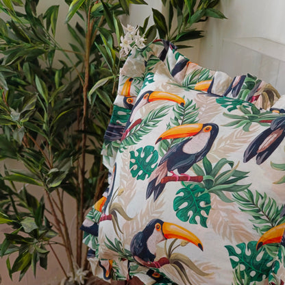 Toucan in the rainforest cushion cover