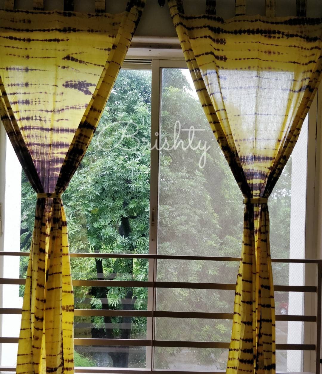 Yellow and brown tie dyed sheer curtains