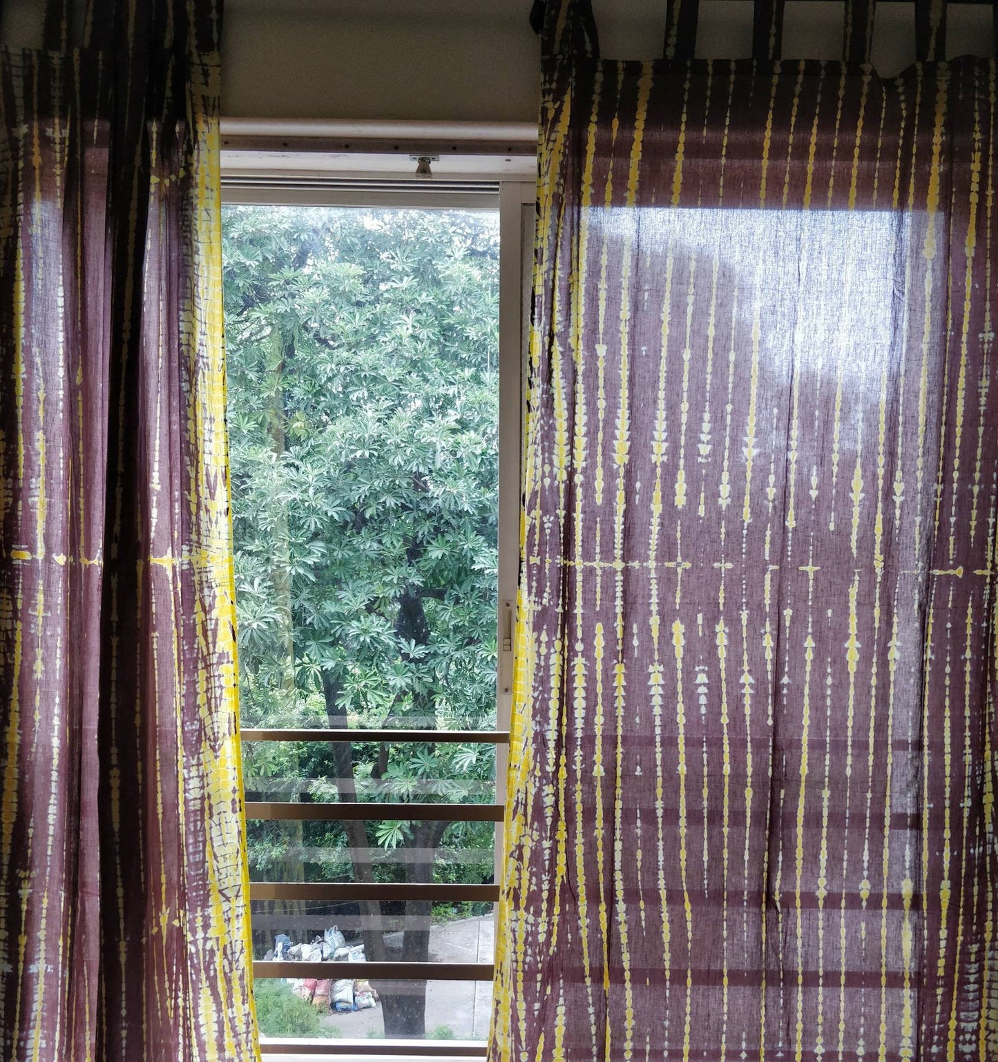 Yellow and brown tie dyed sheer curtain