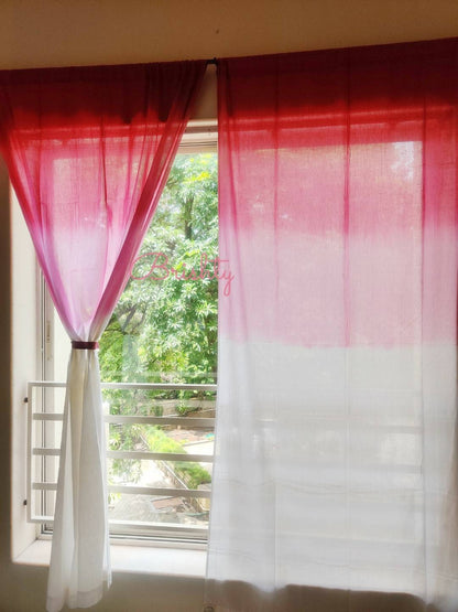 Pink and white ombre sheer curtain panels,