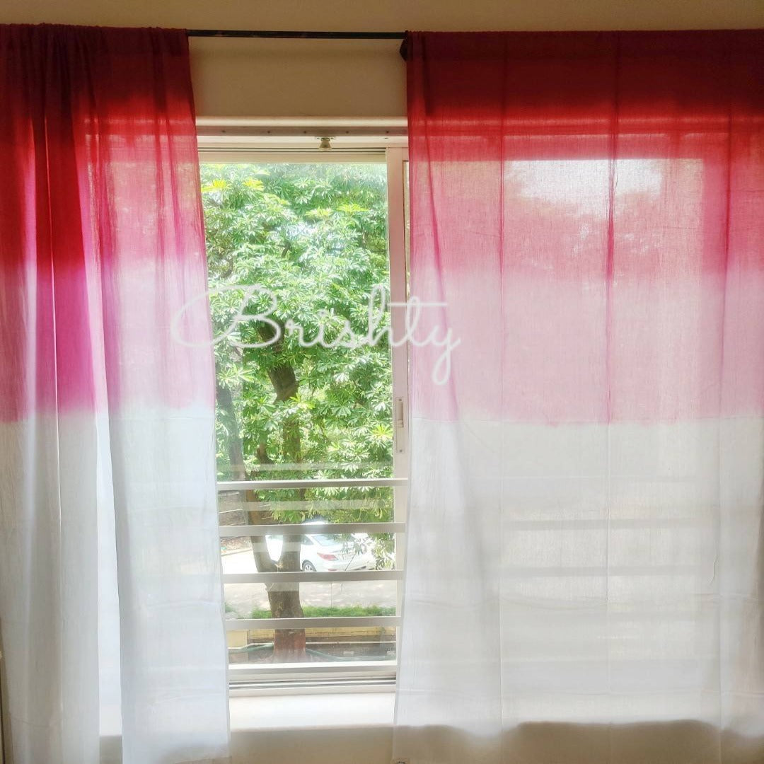 Pink and white ombre sheer curtain panels,